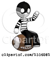 White Thief Man Sitting On Giant Football