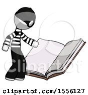 Poster, Art Print Of White Thief Man Reading Big Book While Standing Beside It