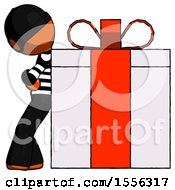 Orange Thief Man Gift Concept Leaning Against Large Present