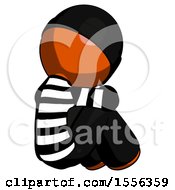 Poster, Art Print Of Orange Thief Man Sitting With Head Down Back View Facing Right