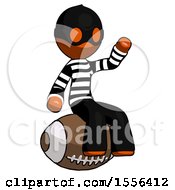 Poster, Art Print Of Orange Thief Man Sitting On Giant Football