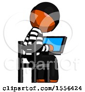 Poster, Art Print Of Orange Thief Man Using Laptop Computer While Sitting In Chair View From Back