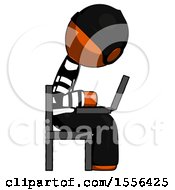 Poster, Art Print Of Orange Thief Man Using Laptop Computer While Sitting In Chair View From Side