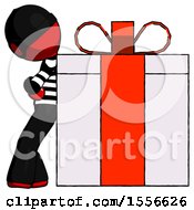 Red Thief Man Gift Concept Leaning Against Large Present
