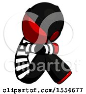 Poster, Art Print Of Red Thief Man Sitting With Head Down Facing Sideways Right