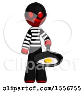 Red Thief Man Frying Egg In Pan Or Wok