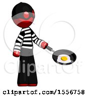 Red Thief Man Frying Egg In Pan Or Wok Facing Right