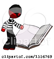 Poster, Art Print Of Red Thief Man Reading Big Book While Standing Beside It