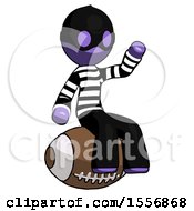 Poster, Art Print Of Purple Thief Man Sitting On Giant Football