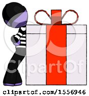 Purple Thief Man Gift Concept Leaning Against Large Present