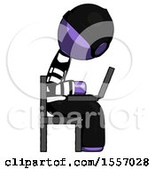 Purple Thief Man Using Laptop Computer While Sitting In Chair View From Side