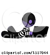 Poster, Art Print Of Purple Thief Man Using Laptop Computer While Lying On Floor Side Angled View
