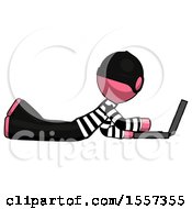 Pink Thief Man Using Laptop Computer While Lying On Floor Side View