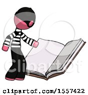 Poster, Art Print Of Pink Thief Man Reading Big Book While Standing Beside It