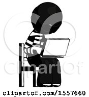 Ink Thief Man Using Laptop Computer While Sitting In Chair Angled Right