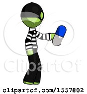 Green Thief Man Holding Blue Pill Walking To Right
