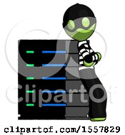 Poster, Art Print Of Green Thief Man Resting Against Server Rack Viewed At Angle