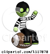 Green Thief Man Sitting On Giant Football