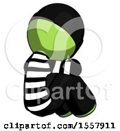 Poster, Art Print Of Green Thief Man Sitting With Head Down Back View Facing Right