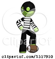 Green Thief Man Standing With Foot On Football