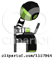 Green Thief Man Using Laptop Computer While Sitting In Chair View From Side