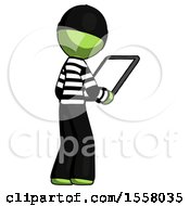 Poster, Art Print Of Green Thief Man Looking At Tablet Device Computer Facing Away