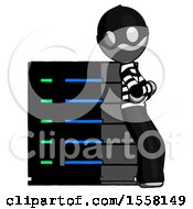 Poster, Art Print Of Gray Thief Man Resting Against Server Rack Viewed At Angle