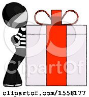 Gray Thief Man Gift Concept Leaning Against Large Present