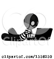 Poster, Art Print Of Gray Thief Man Using Laptop Computer While Lying On Floor Side Angled View