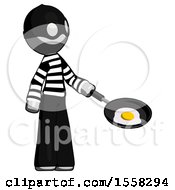 Gray Thief Man Frying Egg In Pan Or Wok Facing Right