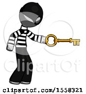Gray Thief Man With Big Key Of Gold Opening Something
