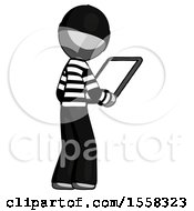 Gray Thief Man Looking At Tablet Device Computer Facing Away