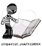 Gray Thief Man Reading Big Book While Standing Beside It