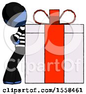 Blue Thief Man Gift Concept Leaning Against Large Present