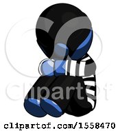 Poster, Art Print Of Blue Thief Man Sitting With Head Down Facing Angle Left