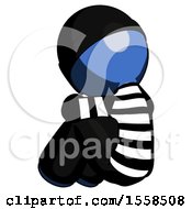 Poster, Art Print Of Blue Thief Man Sitting With Head Down Back View Facing Left