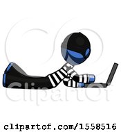 Poster, Art Print Of Blue Thief Man Using Laptop Computer While Lying On Floor Side View