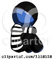 Blue Thief Man Sitting With Head Down Back View Facing Right