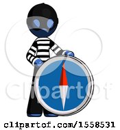 Poster, Art Print Of Blue Thief Man Standing Beside Large Compass