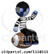 Blue Thief Man Sitting On Giant Football