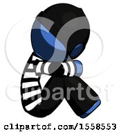Poster, Art Print Of Blue Thief Man Sitting With Head Down Facing Sideways Right
