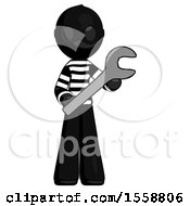 Black Thief Man Holding Large Wrench With Both Hands