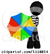 Black Thief Man Holding Rainbow Umbrella Out To Viewer