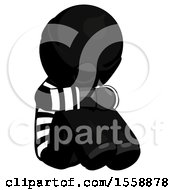 Black Thief Man Sitting With Head Down Facing Angle Right