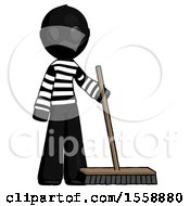 Black Thief Man Standing With Industrial Broom