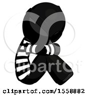 Poster, Art Print Of Black Thief Man Sitting With Head Down Facing Sideways Right