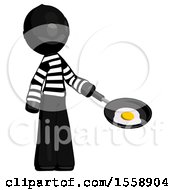 Black Thief Man Frying Egg In Pan Or Wok Facing Right