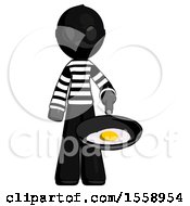 Black Thief Man Frying Egg In Pan Or Wok