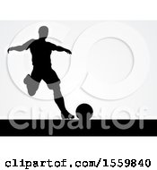 Poster, Art Print Of Black Silhouetted Male Soccer Player Over Gray