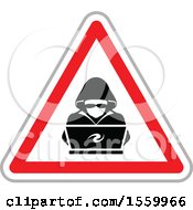Hacker Over A Laptop Computer In A Warning Triangle